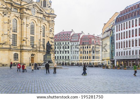 DRESDEN, GERMANY - MARCH 6, 2014: People walk on Neumarkt Square. Neumarkt square is a central and culturally significant section of the Dresden inner city.