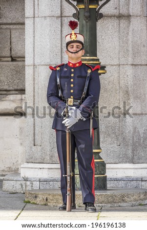 MADRID, SPAIN - NOVEMBER 20, 2013: Spanish Royal Guards participate in the Changing of the Guards outside Madrid\'s Royal Palace in Madrid, capital of Spain.