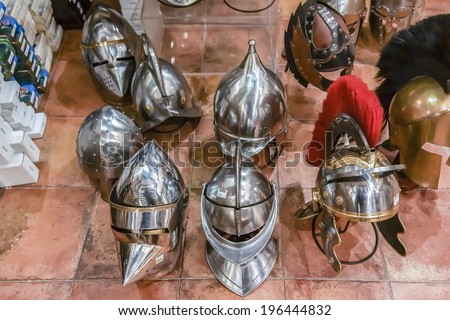 TOLEDO, SPAIN - NOVEMBER 18, 2013: Armor, knives, swords - souvenirs of Toledo. Toledo is historically known for its production of steel, which is currently the most popular souvenir from this city.