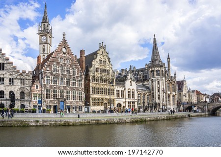 GENT, BELGIUM - MAY 12, 2014: Picturesque medieval gabled houses and tourists in city center of Gent. Ghent is the capital and largest city of the East Flanders province. Belgium.