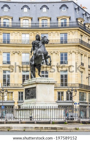 Place des Victoires is a circular place in Paris, located northeast from Palais Royal. At center of Place des Victoires is an equestrian monument in honor of King Louis XIV. France.