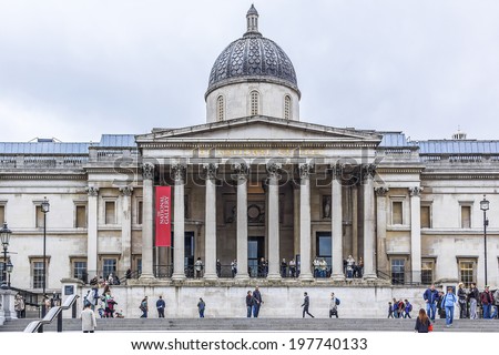 LONDON - MAY 30, 2013: Tourists visit Trafalgar Square in London. Trafalgar Square - the largest square in London, is often considered the heart of London.