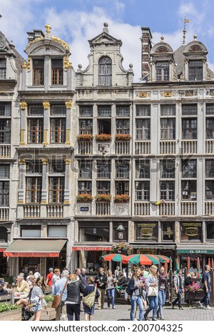 BRUSSELS, BELGIUM - JUNE 19, 2014: Houses of the famous Grand Place (Grote Markt) - the central square of Brussels. Grand Place was named by UNESCO as a World Heritage Site in 1998.