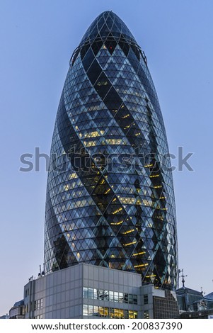 LONDON, UK - JUNE 3, 2013: View of Gherkin building (30 St Mary Axe) at night. Gherkin - iconic symbol of London, one of city\'s most widely recognized examples of modern architecture.