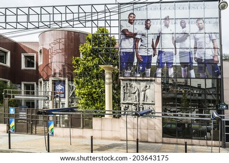 PARIS, FRANCE - JULY 8, 2014: French Football Federation building decorated with colors of national team before 2014 FIFA World Cup - international soccer tournament taking place in Brazil.