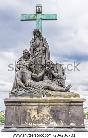 Statue on the Charles Bridge (Karluv most, 1357), a famous historic bridge that crosses the Vltava River in Prague, Czech Republic. Bridge is decorated by 30 statues, originally erected around 1700.
