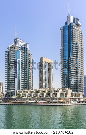 DUBAI, UAE - SEPTEMBER 29, 2012: Modern architecture in Dubai Marina - one of expensive township and most attractive tourist spot. Dubai Marina is an artificial canal city along Persian Gulf shoreline