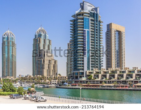 DUBAI, UAE - SEPTEMBER 29, 2012: Modern architecture in Dubai Marina - one of expensive township and most attractive tourist spot. Dubai Marina is an artificial canal city along Persian Gulf shoreline
