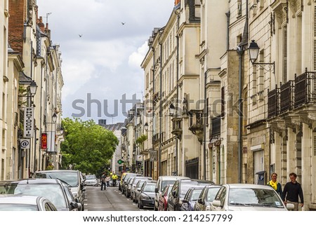TOURS, FRANCE - JULY 20, 2012: View of street in medieval city of Tours. Tours - city in central France, capital of the Indre-et-Loire department. It stands on the lower reaches of the river Loire.