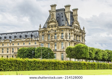 PARIS - JULY 13, 2012: Louvre building in Louvre Museum. Louvre - one of the world\'s largest museums and most visited art museum in the world. France.
