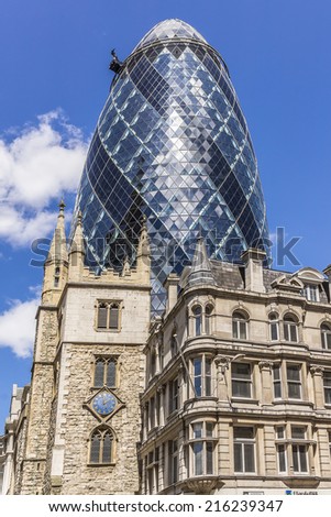 LONDON, UK - JUNE 3, 2013: View of Gherkin building (or 30 St Mary Axe, 2004) in London. Gherkin - iconic symbol of London, one of city\'s most widely recognized examples of modern architecture.