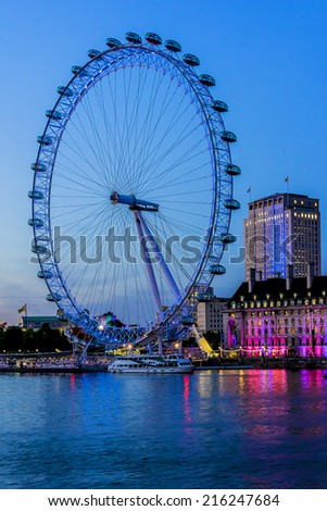 LONDON, UK - JUNE 3, 2013: View of the London Eye at night. London Eye - a famous tourist attraction over river Thames in the capital city London.