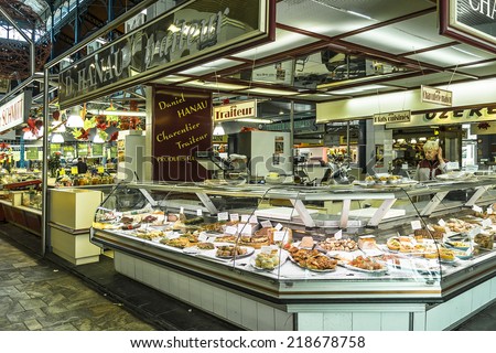 TROYES, FRANCE - MAY 17, 2014: Interior of Les Halles (1876) de Troyes. Gourmet foods and products from Aube region can be found there, such as fruit and vegetables, tripe sausage, cheeses, Champagne.