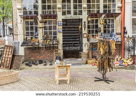 DELFT, THE NETHERLANDS - JUNE 17, 2014: Antique shop near central square in Delft.