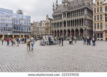 BRUSSELS, BELGIUM - JUNE 19, 2014: Many tourists visiting famous Grand Place (Grote Markt) - the central square of Brussels. Grand Place was named by UNESCO as a World Heritage Site in 1998.