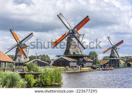 Traditional Dutch old wooden windmill in Zaanse Schans - museum village in Zaandam. The Netherlands.