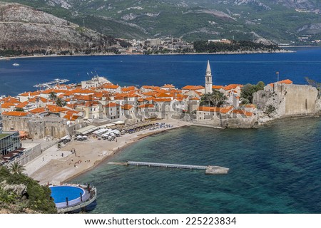 Landscape of Old town Budva: Ancient walls and red tiled roof. Montenegro, Europe. Budva - one of the best preserved medieval cities in the Mediterranean and most popular resorts of Adriatic Riviera.