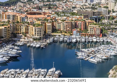 Panoramic view of Fontvieille - new district of Monaco. Boats and a high-rise apartment complex. Principality of Monaco is a sovereign city state, located on the French Riviera in Western Europe.