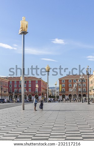 NICE, FRANCE - AUGUST 29, 2012: People hang around Place Massena in Nice. It is Main Square of the city and it is used for concerts and other events which take place in the city.