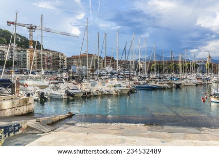 NICE, FRANCE - JULY 11, 2014: View on Port of Nice and yachts, boats, ships. French Riviera - turquoise sea and perfect recreation.