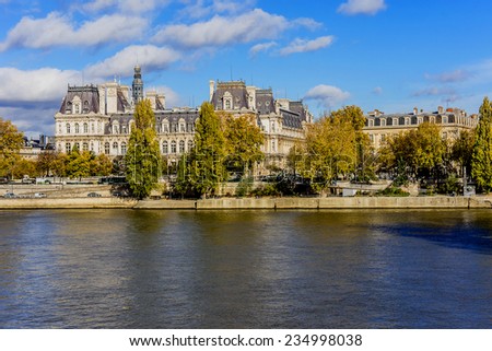 Embankment of Seine River and Hotel-de-Ville (City Hall, 1874 -1882, architects Theodore Ballou and Edouard Deperta) in Paris - building housing City of Paris\'s administration. France.