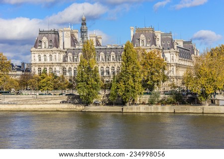 Embankment of Seine River and Hotel-de-Ville (City Hall, 1874 -1882, architects Theodore Ballou and Edouard Deperta) in Paris - building housing City of Paris\'s administration. France.