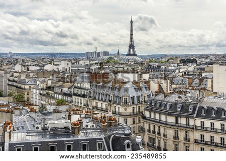 Panorama of Paris - Eiffel tower in the background. Tour Eiffel (Eiffel Tower) located on Champ de Mars in Paris, named after engineer Gustave Eiffel. View from Printemps store. France.