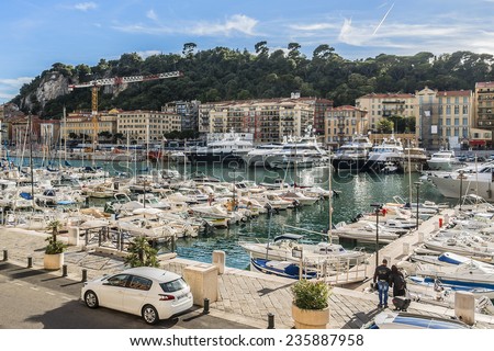 NICE, FRANCE - JULY 11, 2014: View on Port of Nice with yachts, boats, ships. French Riviera - turquoise sea and perfect recreation.