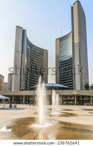 TORONTO, CANADA - JULY 23, 2014: City Hall (or New City Hall, by Finnish architect Viljo Revell, 1965) is one of Toronto\'s best known landmarks. City Hall is home of municipal government of Toronto.