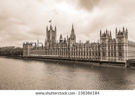 River Thames and Palace of Westminster (known as Houses of Parliament). Palace of Westminster located on bank of River Thames in City of Westminster, London. Vintage sepia photo.