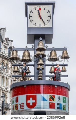 LONDON, UK - MAY 31, 2013: View of Swiss glockenspiel clock (erected 1985) on Leicester Square in London. Under the clock have 27 bells and figures of traditional Swiss Alpine farmers.