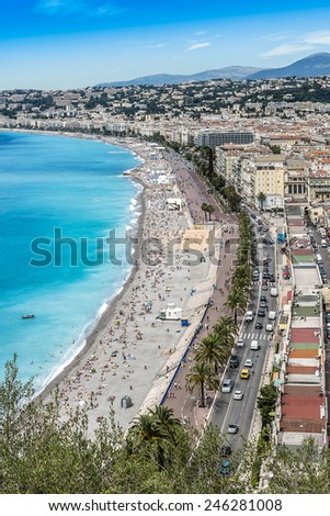 Beautiful panorama city of Nice - luxury resort of French Riviera. Cote d\'Azur France. Mediterranean Sea, public beach, Promenade des Anglais, palms and houses of Nice.
