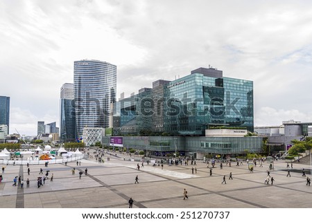 PARIS - JULY 13, 2012: Skyscrapers in business district of Defense to the west of Paris. Defense is biggest business district in France and most of large companies have offices here.