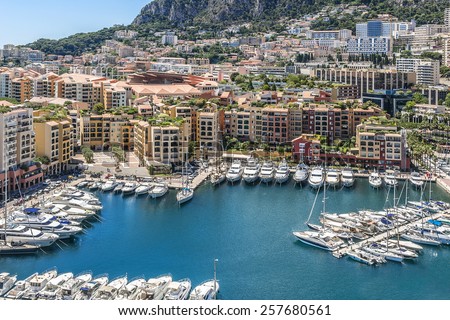 Panoramic view of Fontvieille - new district of Monaco. Boats and a high-rise apartment complex. Principality of Monaco is a sovereign city state, located on the French Riviera in Western Europe.