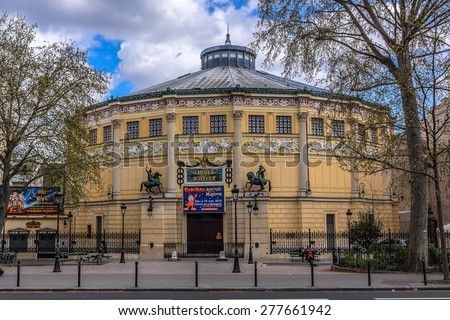 PARIS, FRANCE - APRIL 12, 2015: View of Cirque d\'Hiver (Winter Circus). Theatre was designed by architect Jacques Ignace Hittorff and was opened by Emperor Napoleon III in 1852 as Cirque Napoleon.