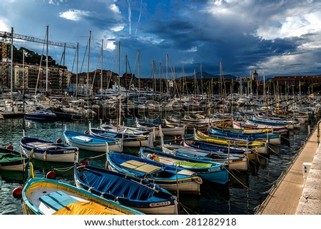 NICE, FRANCE - JULY 11, 2014: View on Port of Nice with yachts, boats, ships. French Riviera - turquoise sea and perfect recreation.