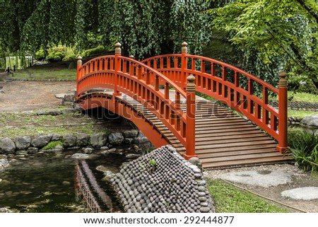 Wonderful wooden bridge Pond in beautiful Albert Kahn Park. Boulogne-Billancourt, Paris, France.