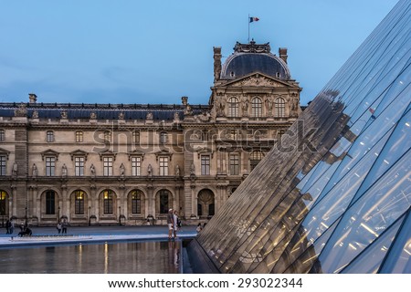 PARIS, FRANCE - JUNE 10, 2015: View of famous Louvre Museum late evening. Louvre Museum is one of the largest and most visited museums worldwide.