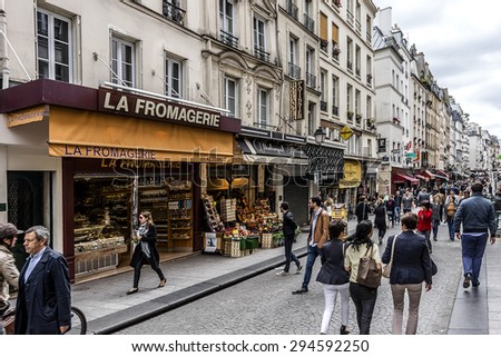 PARIS, FRANCE - JUNE 2, 2015: View of Rue Montorgueil - street in Montorgueil-Saint Denis-Les Halles district of Paris. Street is full of restaurants, cafes, bakeries, cheese shops, flower shopsÃ¢Â?Â¦