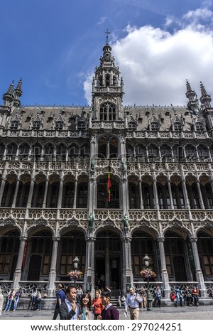 BRUSSELS, BELGIUM - JUNE 19, 2014: Many tourists visiting area of famous Grand Place (Grote Markt) - the central square of Brussels. Grand Place was named by UNESCO as a World Heritage Site in 1998.
