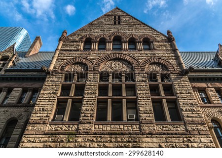TORONTO, CANADA - 23 JULY, 2014: Toronto\'s Old City Hall (architect Edward James Lennox, 1899) was home to its city council from 1899 to 1966 and remains one of the city\'s most prominent structures.