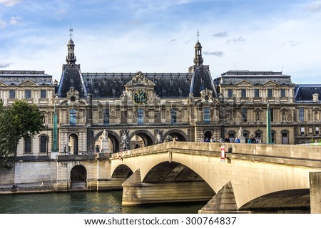 PARIS, FRANCE - MAY 30, 2015: View of famous Louvre Museum from the Seine River. Louvre Museum is one of the largest and most visited museums worldwide.
