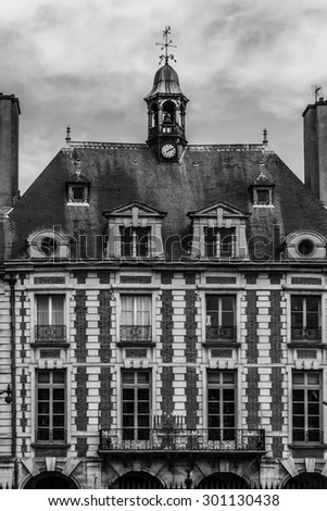 Place des Vosges - oldest planned square in Paris, in Marais district. Place des Vosges was built by Henri IV from 1605 to 1612. Black and white.