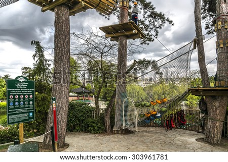 PARIS, FRANCE - APRIL 25, 2015: View of Jardin d'Acclimatation (opened in1860 by Napoleon III and Empress Eugenie) - 20-hectare children's amusement park located in Bois de Boulogne.
