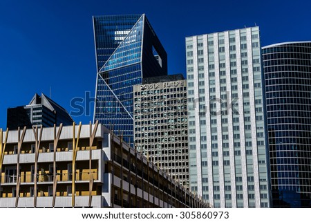 PARIS, FRANCE - JUNE 8, 2015: Skyscrapers in business district of Defense to the west of Paris. Defense is biggest business district in France and most of large companies have offices here.
