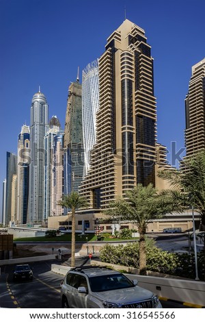 DUBAI, UAE - SEPTEMBER 8, 2015: Modern skyscrapers in Dubai Marina. Marina - artificial canal city, carved along a 3 km stretch of Persian Gulf shoreline.
