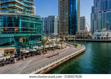 DUBAI, UAE - SEPTEMBER 8, 2015: Modern skyscrapers in Dubai Marina. Marina - artificial canal city, carved along a 3 km stretch of Persian Gulf shoreline.