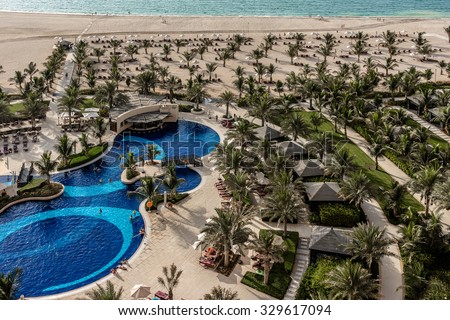 RAS Al KHAIMAH, UAE - SEPTEMBER 6, 2015: The luxury 5 stars DoubleTree by Hilton Hotel Resort and Spa Marjan Island. RAK. A lovely pool area.