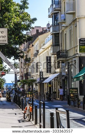 CANNES, FRANCE - AUGUST 30, 2011: Cityscape Cannes. Cannes - a resort in southern France: many flowers and palm, luxury boutiques and restaurants, cafes, luxurious hotels - all for leisure travelers.