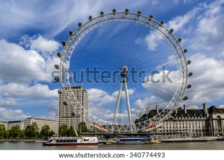 LONDON, UK - MAY 25, 2013: View of the London Eye. London Eye (135 m tall, diameter of 120 m) - a symbol of London and famous tourist attraction over river Thames in the capital city London.